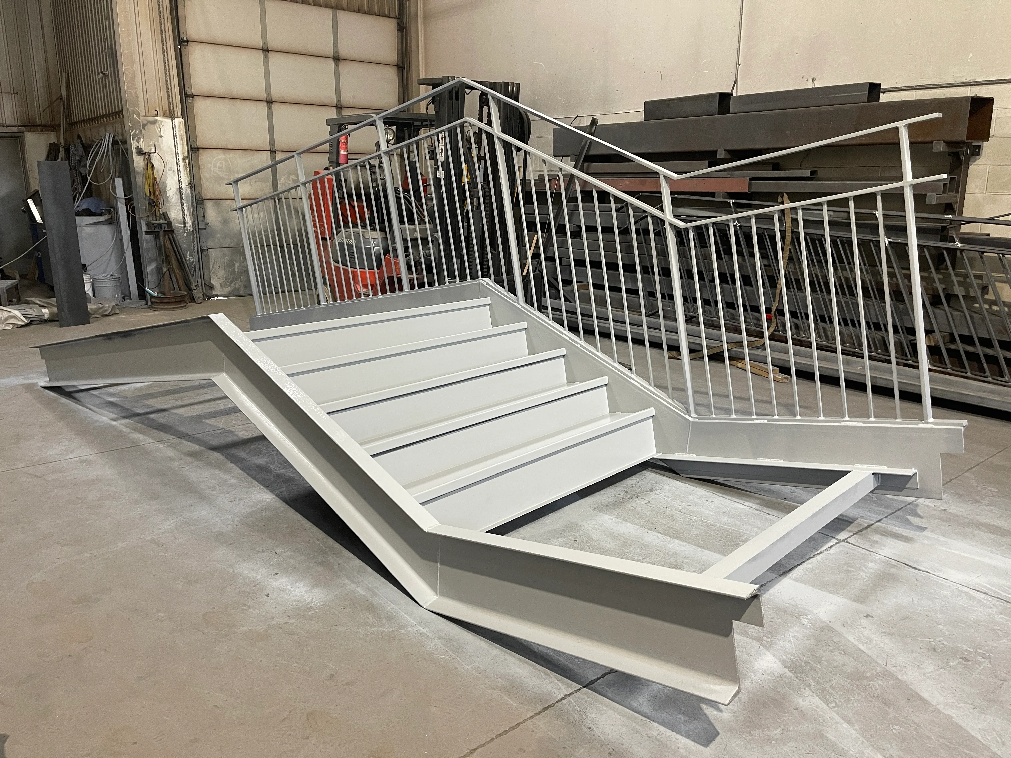 Fabricated steel industrial access stair with railings and pickets.